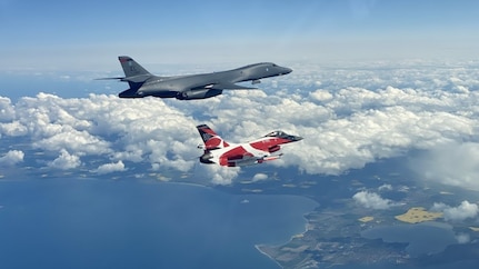 A B-1B Lancer flies with a Danish F-16 during a training mission for Bomber Task Force Europe, May 5, 2020. Aircrews from the 28th Bomb Wing at Ellsworth Air Force Base, South Dakota, took off on their long-range, long-duration Bomber Task Force mission to conduct interoperability training with Danish fighter aircraft and Estonian joint terminal attack controllers ground teams. Training with our NATO allies and theater partner nations contribute to enhanced resiliency and interoperability and enables us to build enduring relationships necessary to confront the broad range of global challenges.