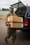 Sgt. Adam Szabo, 1431st Sapper Combat Engineer, Michigan Army National Guard, delivers personal protective equipment in Munising, Michigan, April 29, 2020. The Michigan National Guard Soldiers and Airmen are actively supporting the state's COVID-19 response.