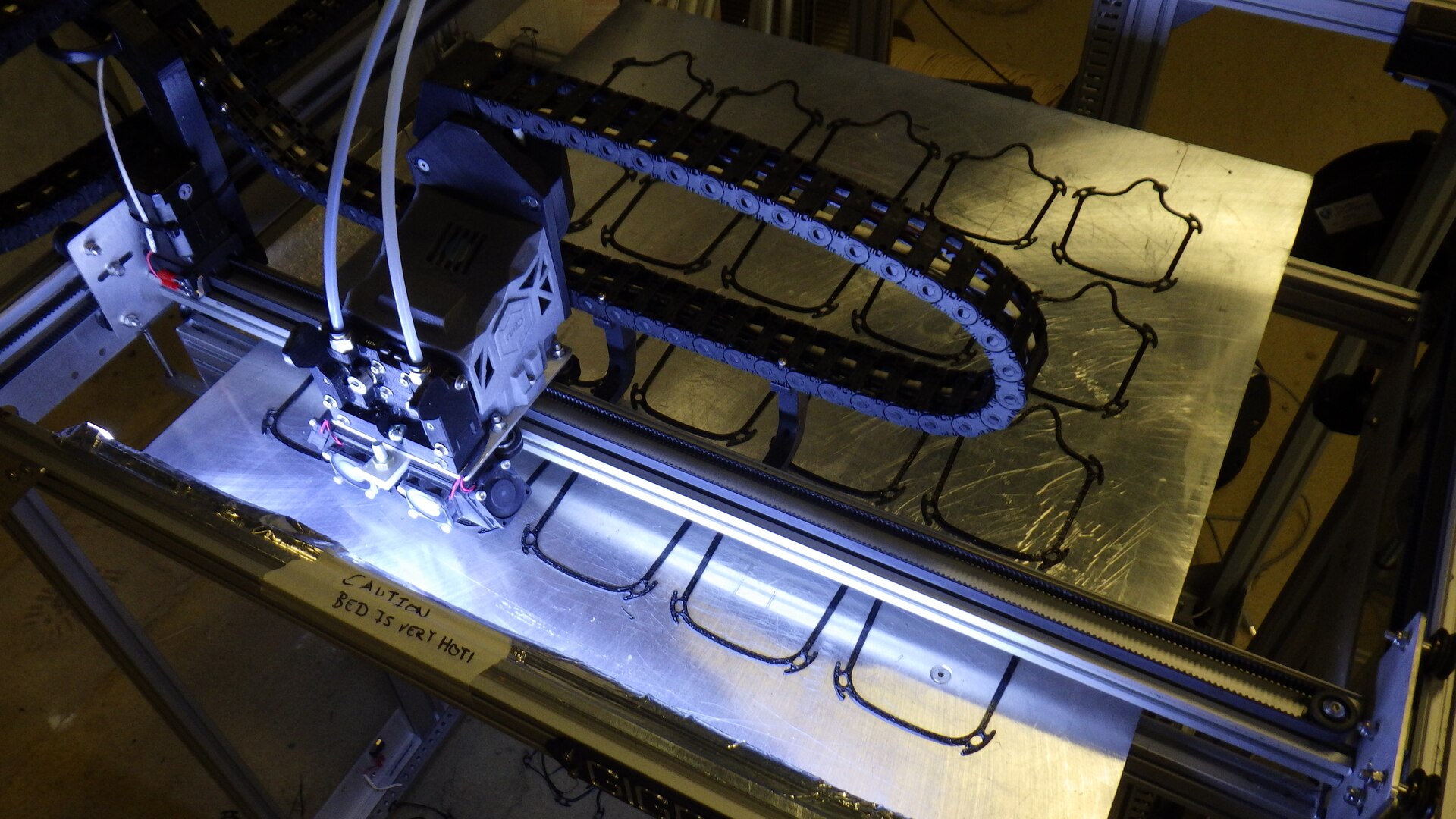 A 3D printer makes face mask frames on April 10, 2020, in the Additive Manufacturing Lab at Naval Surface Warfare Center Carderock Division in West Bethesda, Md.