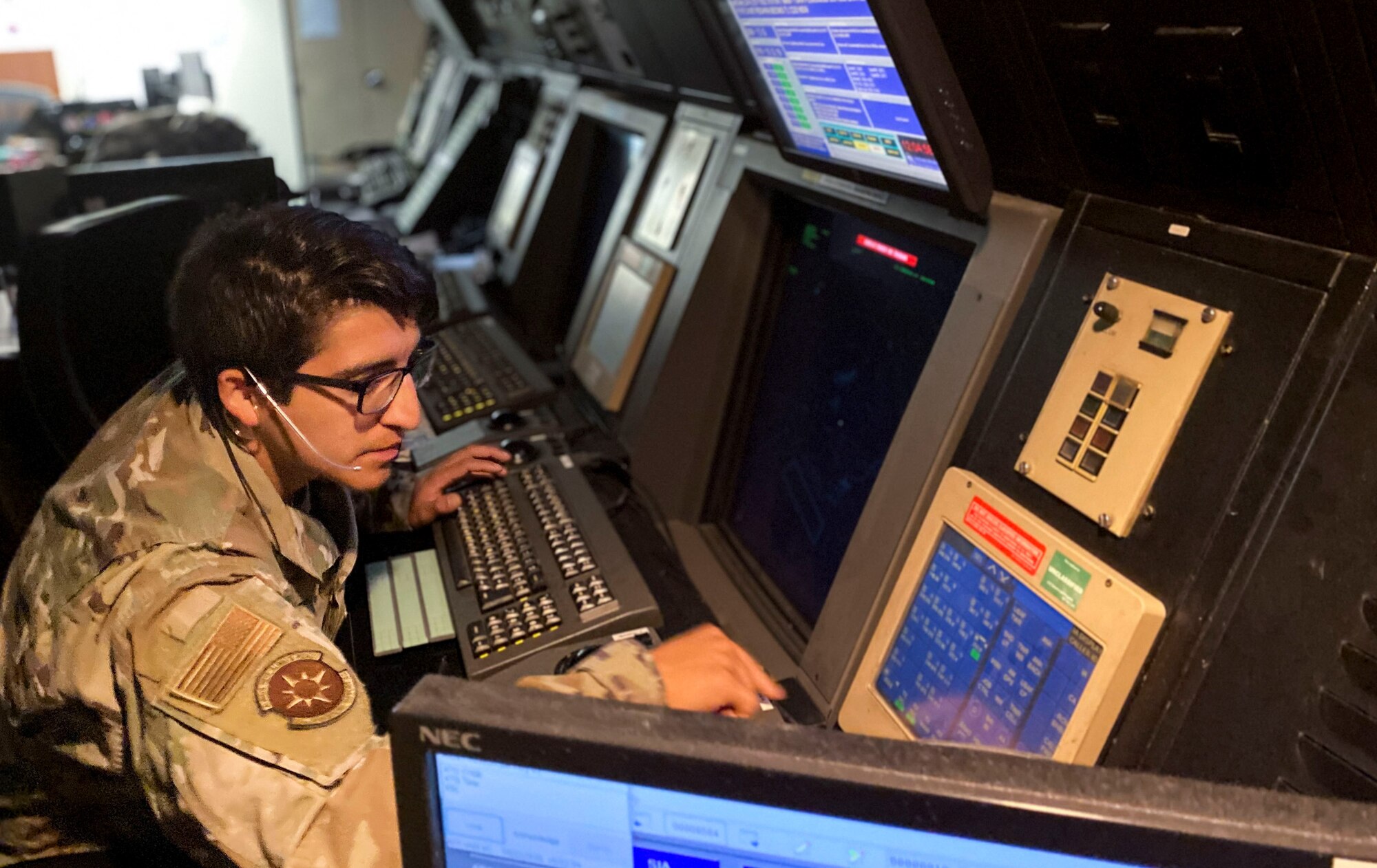 Photo of Airman monitoring screens