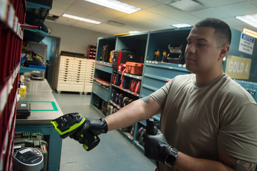 Staff Sgt. Miguel Meraz, 437th Aircraft Maintenance Squadron Viper Flight Composite Tool Kit Section shift supervisor, scans tools and equipment to maintain accountability of assets May 1, 2020, at Joint Base Charleston, S.C. The 437th AMXS CTK Section is responsible for the accountability of thousands of pieces of equipment including more than 2,000 tool kits. The CTK team implemented a process where maintainers disinfect their tools prior to turn in. After communicating over radio, tools are sanitized in a designated room used for tool transfer with personnel keeping a six foot distance to help prevent health risks associated with COVID-19.