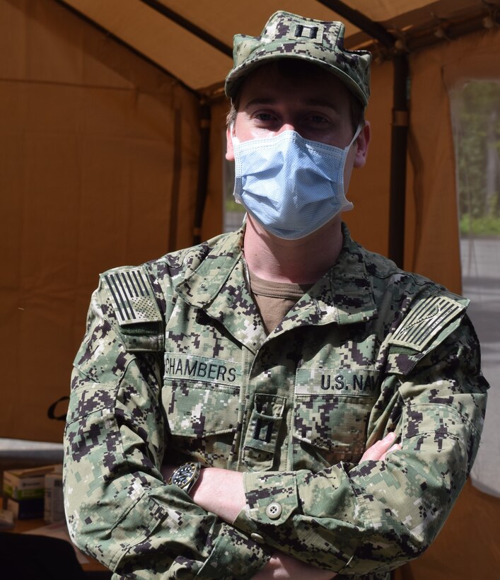 A Navy medical officer poses for a photo.