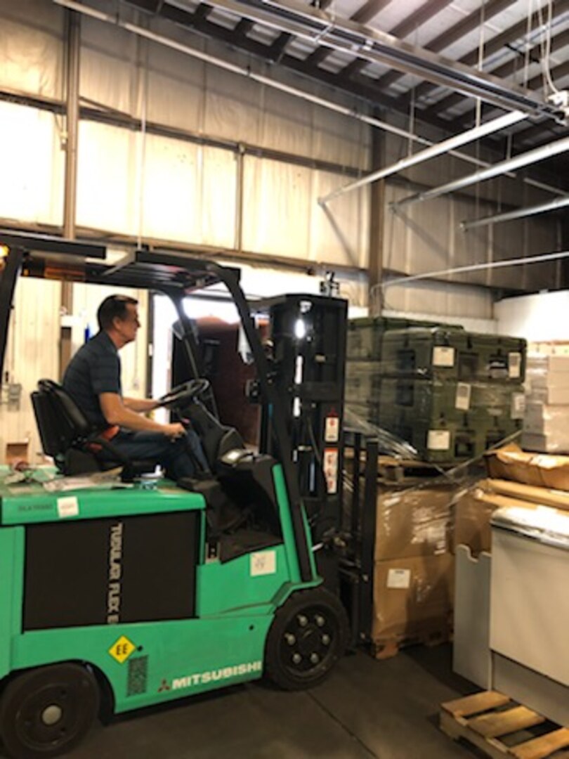 Property Disposal Specialist Eddie Sanders moves some of the $330,000 worth of medical equipment and supplies intended for first responders fighting COVID-19 throughout Florida. The material is from DLA Disposition Services’ site at Fort Bragg, North Carolina.