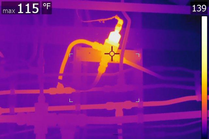 A thermal image shows the heat signatures of aircraft components.