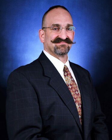 IMAGE: DAHLGREN, Va. – Michael Busansky assumed duties as the Contracts Department head at Naval Surface Warfare Center Dahlgren Division in January. Throughout his federal civil service career, Busansky resolved a myriad of challenges to acquiring products and services. Today, he leads efforts to identify and document methods to improve contracts cycle time while maintaining the integrity of the contracting process in spite of telework due to COVID-19 restrictions. “I am extremely proud that the team is able to continue supporting our stakeholders with no negative impact to productivity,” said Busansky. “As long as we can maintain communications with our stakeholders and connectivity to our acquisition systems, we can continue providing acquisition support regardless of where we might be physically located.” (U.S. Navy photo/Released)