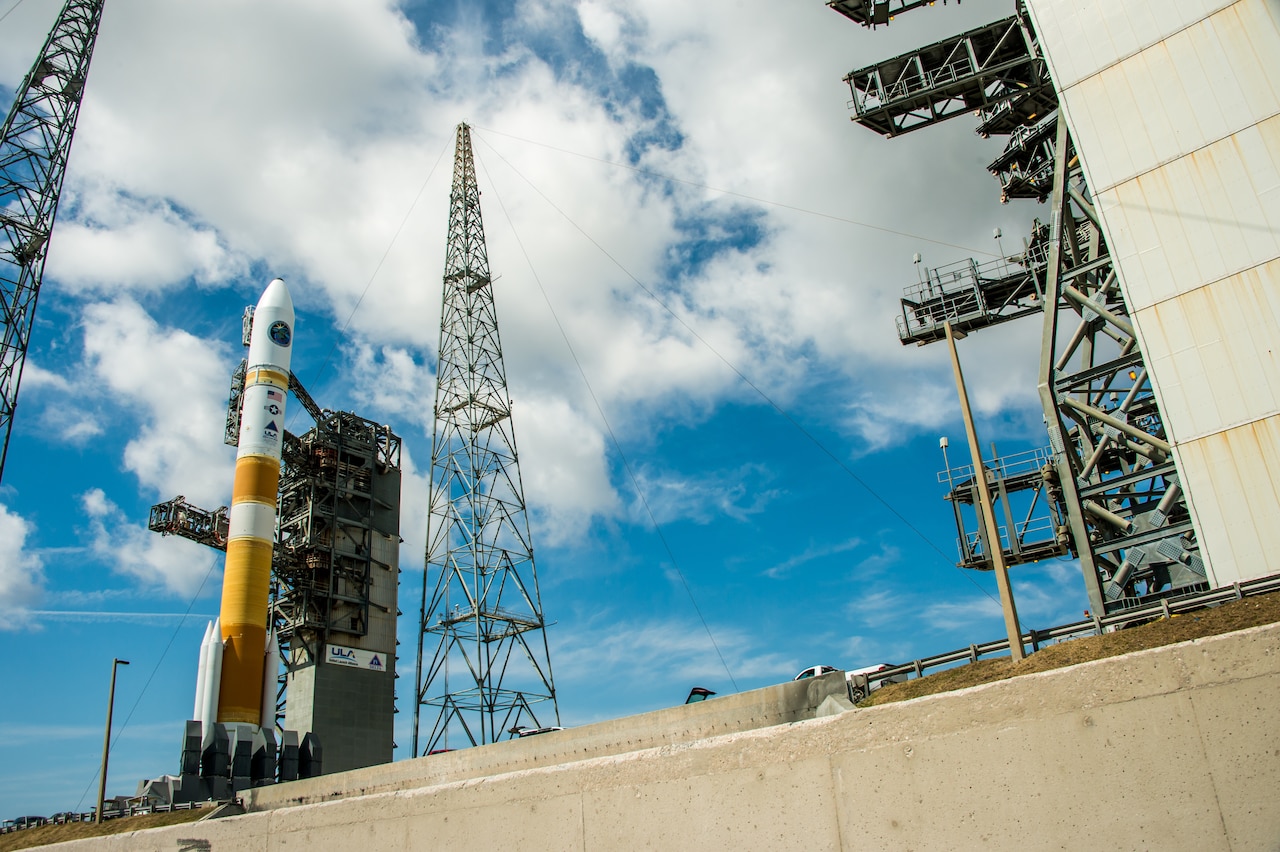 A rocket stands on a launch pad.