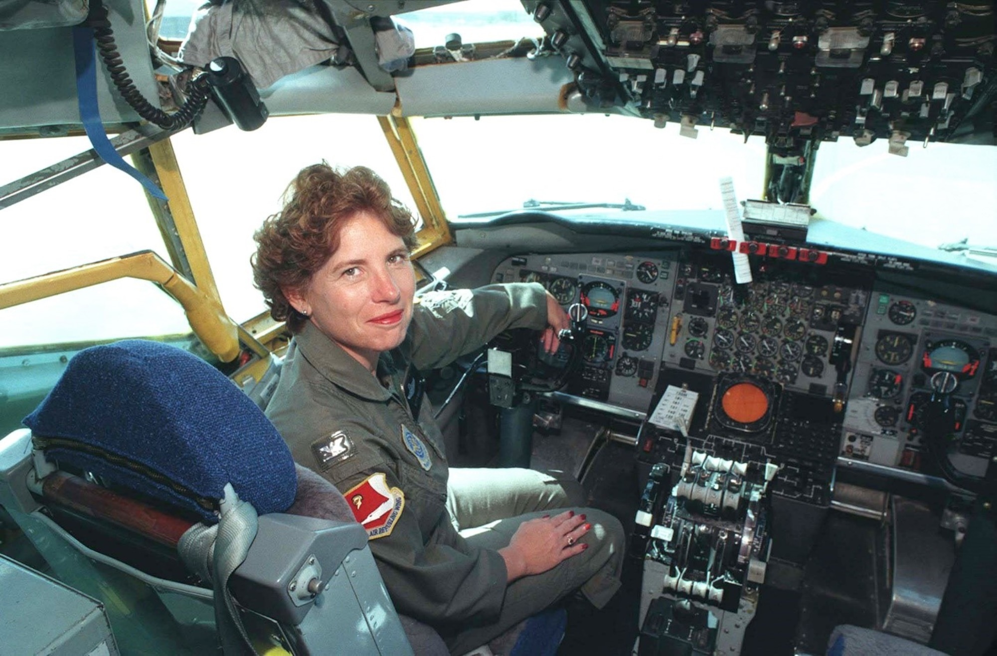 Colonel Betty L. Mullis sits in the flight deck in the 1990s in Northern California.