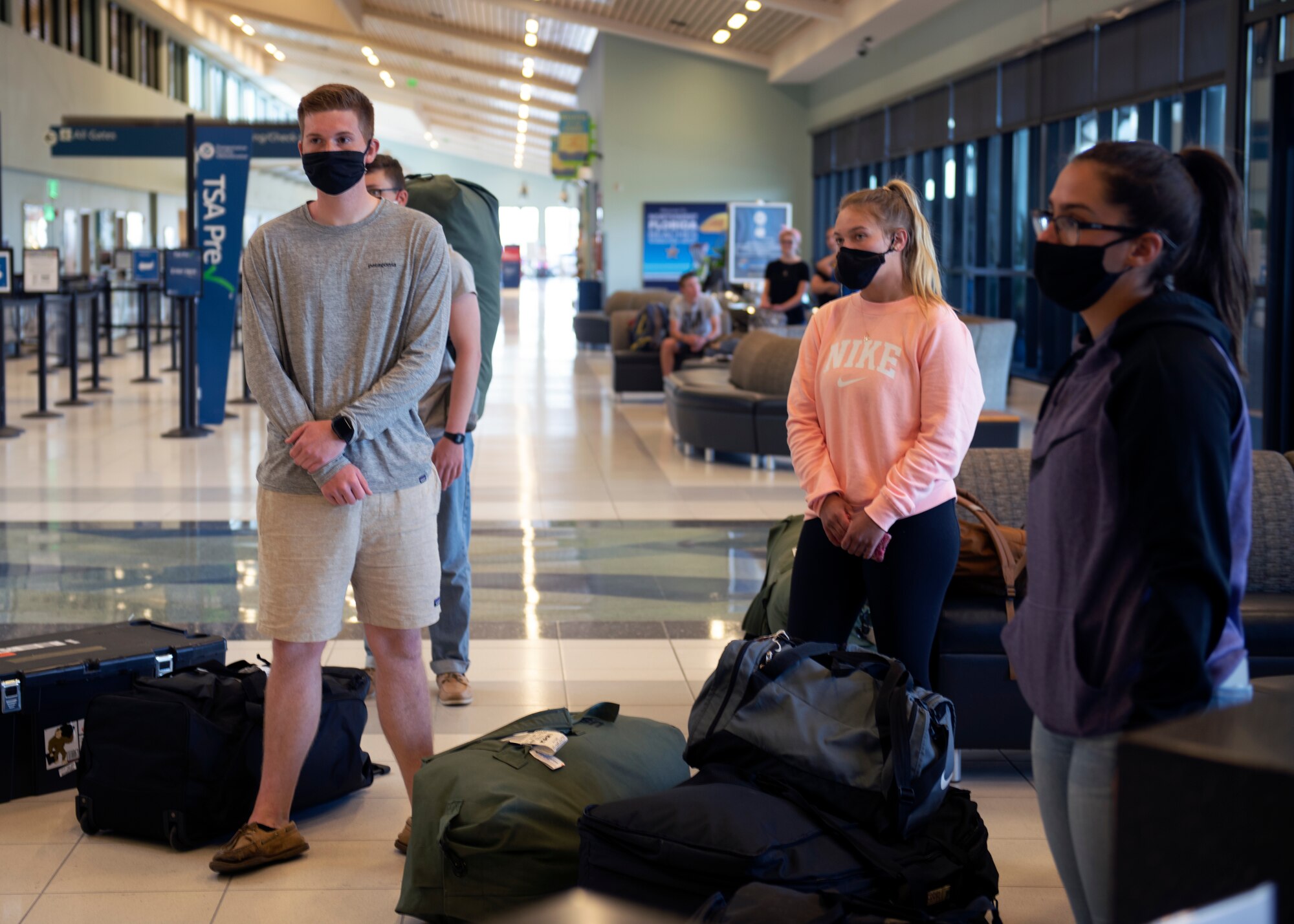 Airmen prepare to depart the Northwest Florida Beaches International Airport in Panama City, Florida, May 5, 2020. Technical training graduates arriving to Tyndall Air Force base follow additional guidelines due to the COVID-19 Pandemic. (U.S. Air Force photo by Brad Sturk)