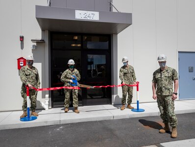 Leadership from Puget Sound Naval Shipyard & Intermediate Maintenance Facility, Naval Base Kitsap and Naval Facilities Engineering Command Northwest take part in a ribbon-cutting ceremony for new and upgraded shipyard here facilities May 6. The ribbon cuttings signify the upgrade of Buildings 435 and construction completion of Building 1247, which collectively provide a new environmental laboratory, light industrial work spaces, administrative and personnel support areas, an upgraded fire station, a new employee food services kitchen and a cafeteria.