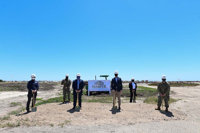 NSWC PHD Technical Director Paul Mann, (far left); Cmdr. Andrew Olsen (back left) with NAVFAC/NBVC; Thomas Dowd, director, range department, NAWCWD/NAVAIR (front left); Jeff Harper (front center) of Harper Construction Co. Inc.; Marcos Gonzales (right back), NSWC PHD project lead for the Directed Energy Systems Integration Laboratory (DESIL); and NSWC PHD Commanding Officer Capt. Ray Acevedo (far right) at the DESIL groundbreaking, May 5.