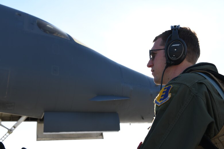 Aircrew assigned to the 34th Bomb Squadron step to a B-1B Lancer for a non-stop deployment from Ellsworth Air Force Base, S.D., May 4, 2020. Strategic bomber missions enhance the readiness and training necessary to respond to any potential crisis or challenge across the globe. (U.S. Air Force photo by Senior Airman Nicolas Z. Erwin)