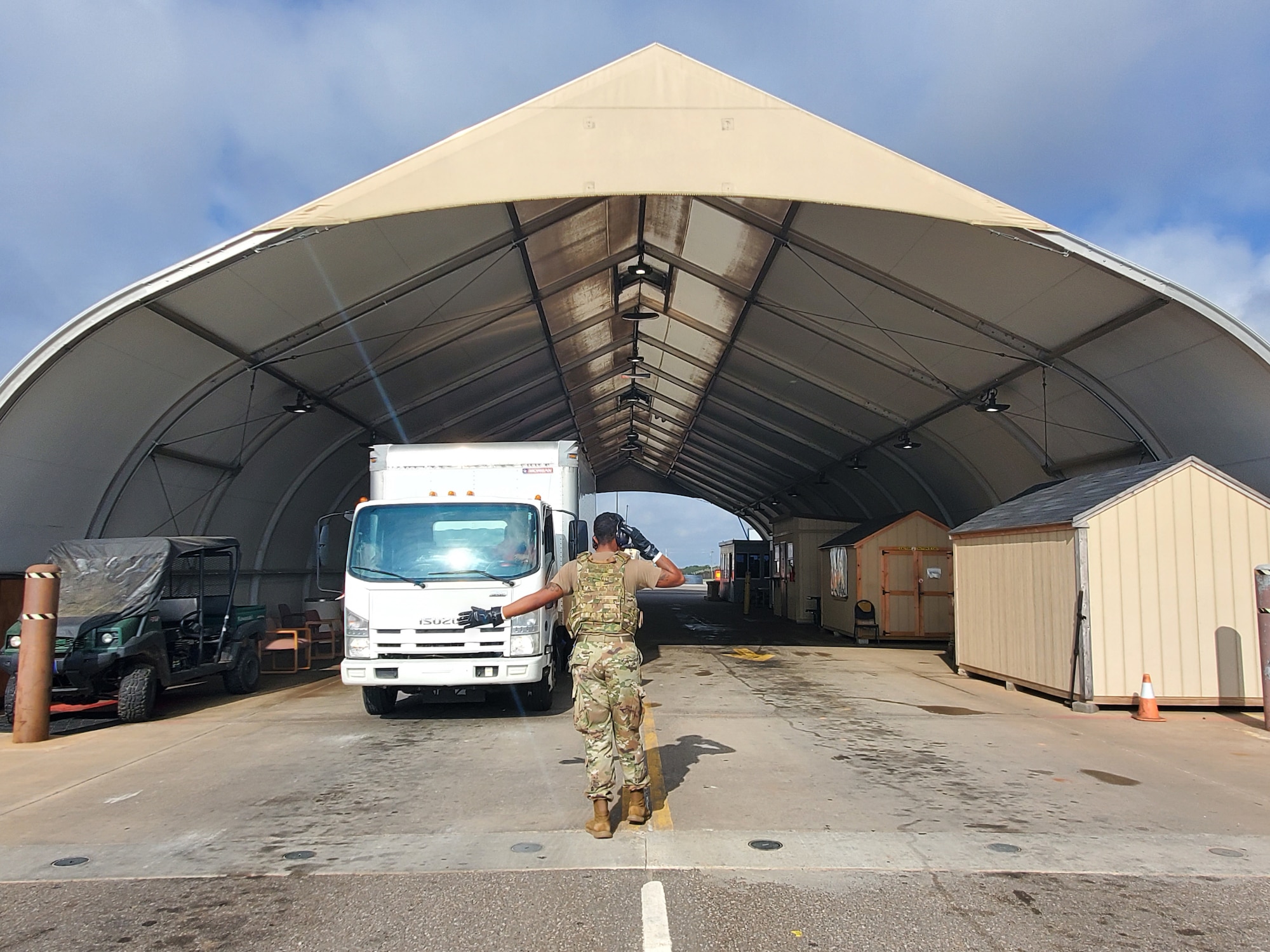 Airmen working the Truck Gate are currently required to wear personal protective equipment such as gloves and masks due to the threat of COVID-19.