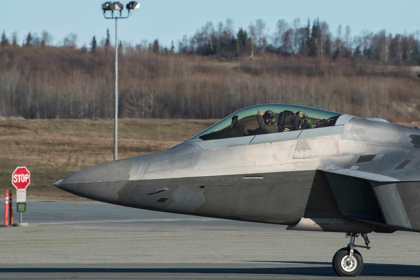 A U.S. Air Force F-22 Raptor taxis onto the runway prior to an elephant walk, May 5, 2020, at Joint Base Elmendorf-Richardson, Alaska. This event displayed the ability of the 3rd Wing, 176th Wing and the 477th Fighter Group to maintain constant readiness throughout COVID-19 by Total Force Integration between active-duty, Guard and Reserve units to continue defending the U.S. homeland and ensuring a free and open Indo-Pacific.
