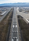 U.S. Air Force aircraft assigned to the 3rd Wing, 176th Wing and 477th Fighter Group participate in a close formation taxi, known as an Elephant Walk, at Joint Base Elmendorf-Richardson, Alaska, May 5, 2020. The large show-of-force demonstrated the wings’ rapid mobility capabilities and response readiness during COVID-19 and also highlighted the ability to generate combat airpower at a moment’s notice to ensure regional stability throughout the North American Aerospace Defense Command Region and Indo-Pacific. Aircraft included F-22 Raptors, C-17 Globemaster IIIs, E-3 Sentrys, C-12F Hurons, C-130J Super Herculeses and HH-60G Pave Hawks.