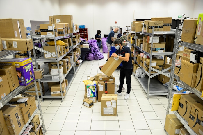 NAPLES, Italy (April 30, 2020) Francesco Ciccarelli, postal clerk, organizes incoming mail at the Naval Support Activity (NSA) Naples Support Site post office, attached to Naval Supply Systems Command Fleet Logistics Center (NAVSUP FLC) Sigonella, April 30, 2020. Commander, U.S. Naval Forces Europe-Africa/ U.S. 6th Fleet, headquartered in Naples, Italy, oversees joint and naval operations, often in concert with Allied, joint, and interagency partners, in order to advance U.S. national interests and security and stability in Europe and Africa. (U.S. Navy photo by Mass Communication Specialist Chief Justin Stumberg/Released)