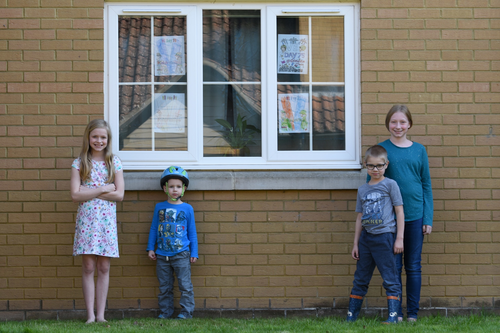 Children of a U.S. Air Force Airman display Victory in Europe Day artwork in their windows in Liberty Village at Royal Air Force Lakenheath, England, May 6, 2020. On May 8, the U.K. will join the U.S. and allies around the world to mark the 75th anniversary of VE Day, with virtual programs to avoid the spread of COVID-19. (U.S. Air Force photo by Airman 1st Smith Rhonda Smith)
