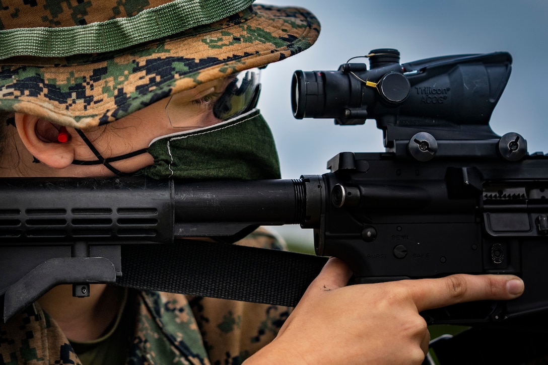 A U.S. Marine sights in on her target on Camp Hansen, Okinawa, Japan, May 6.