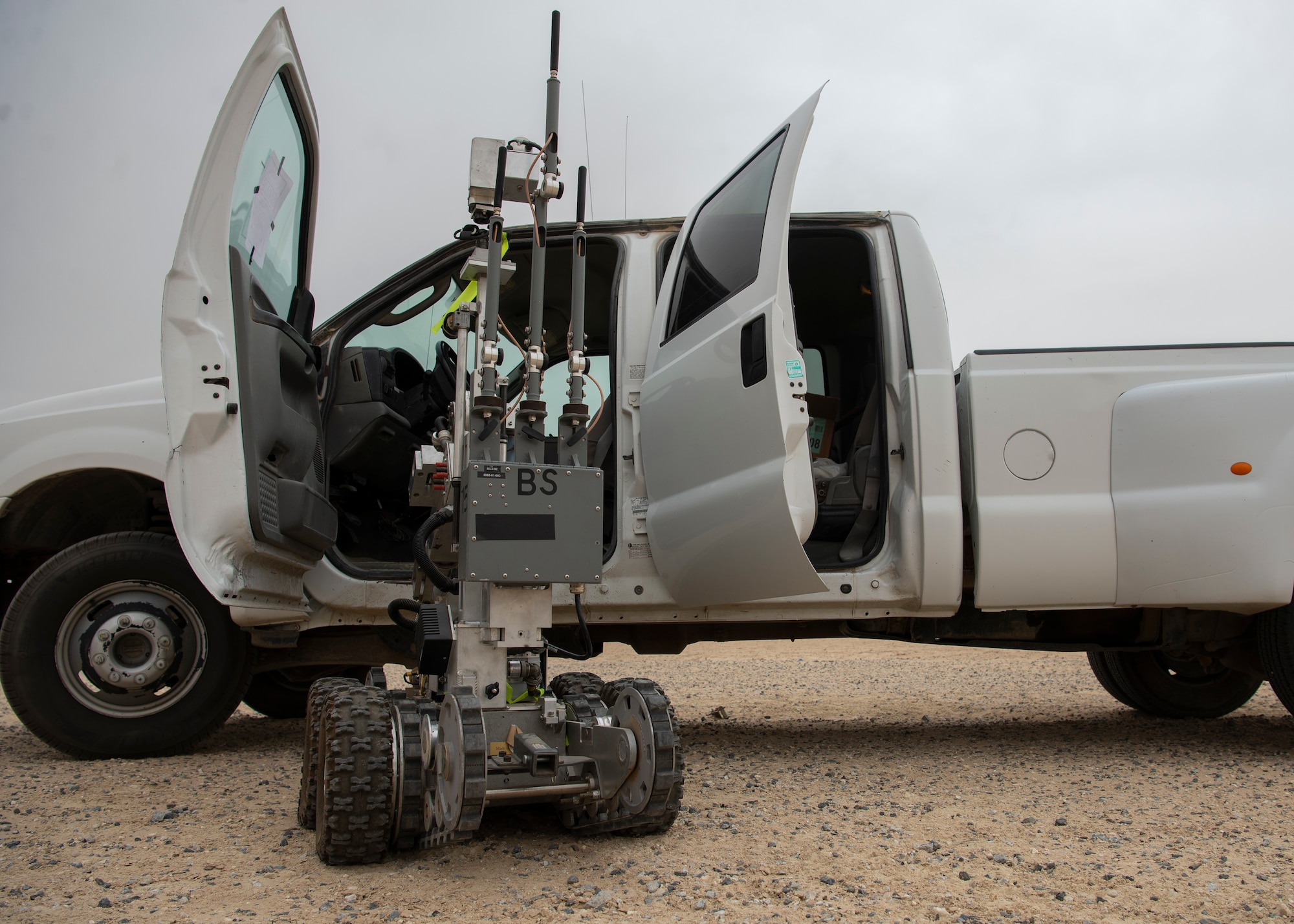 An explosive ordnance disposal robot, piloted by a 386th Expeditionary Civil Engineer Squadron EOD technician, assesses a vehicle during a an all-hazard training exercise at Ali Al Salem Air Base, Kuwait, May 5, 2020. The exercise was designed to enhance interoperability between multiple first responder teams with the goal of responding, identifying and controlling potential real-world scenarios. (U.S. Air Force photo by Senior Airman Isaiah J. Soliz)