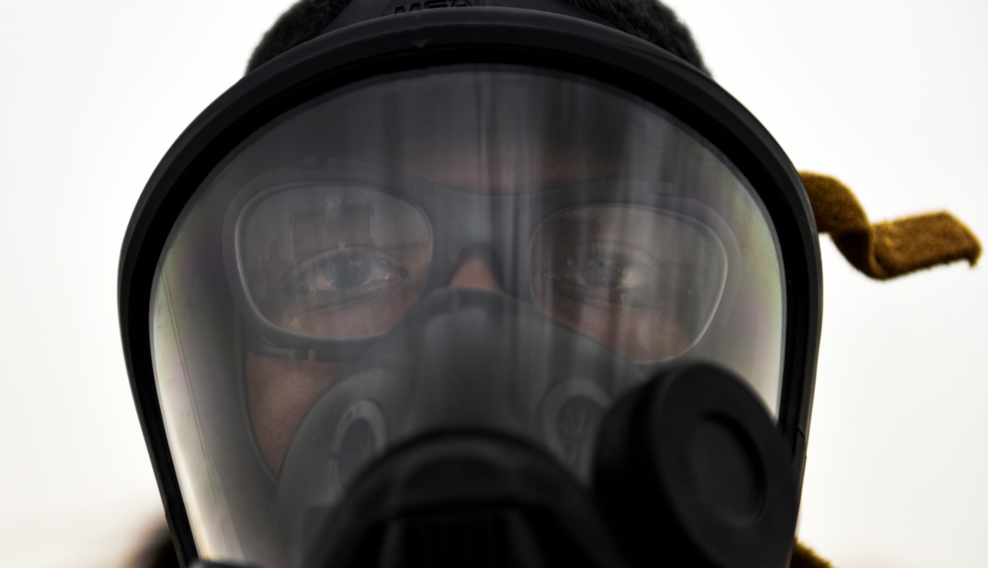 An Airmen dons an oxygen mask while responding during an all-hazard exercise at Ali Al Salem Air Base, Kuwait, May 5, 2020. Responding agencies practiced their skills together to build cohesion and learn each other's capabilities during the all-hazard response exercise. (U.S. Air Force photo by Senior Airman Kevin Tanenbaum)