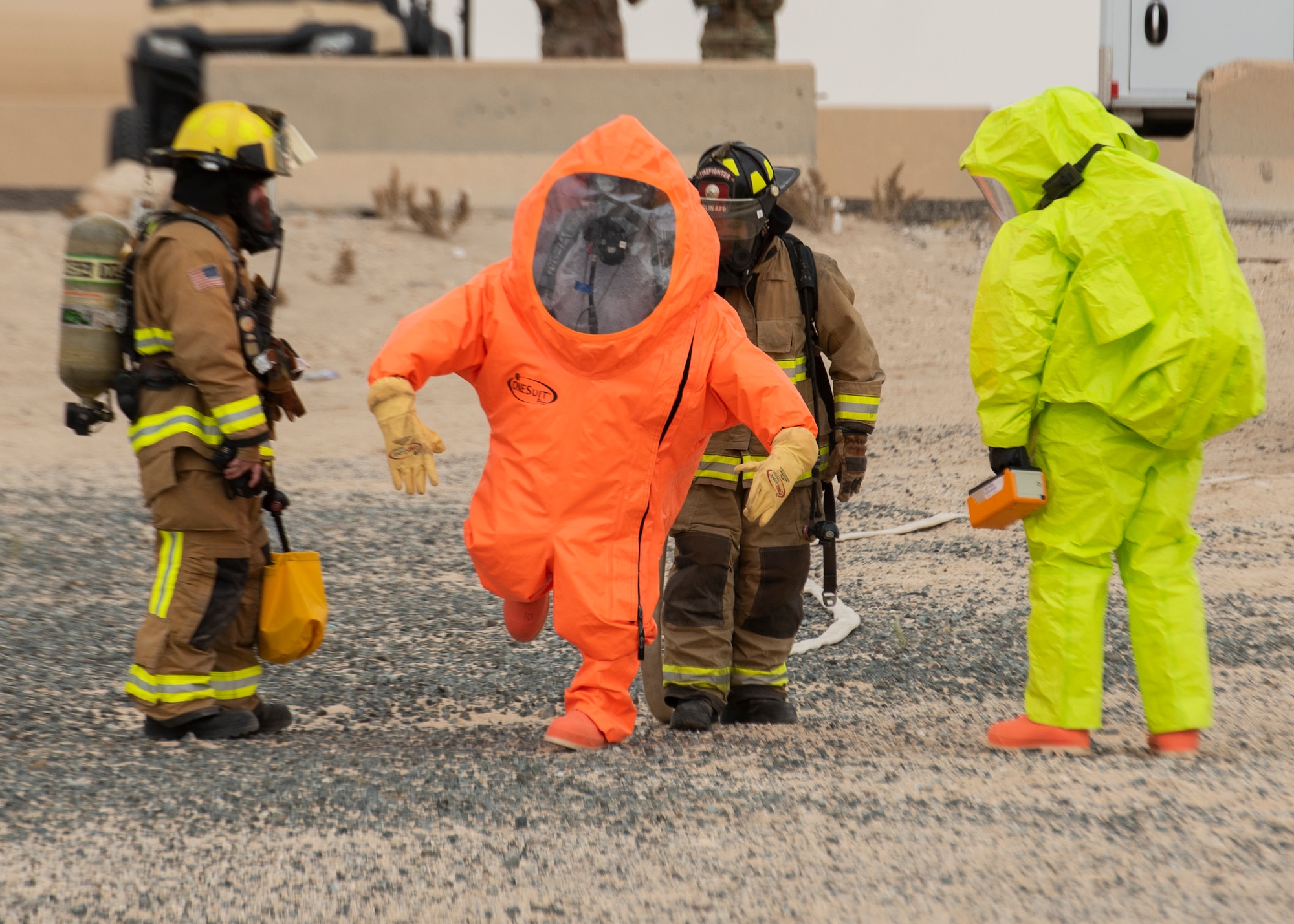 First responders from the 386th Air Expeditionary Wing respond to a simulated chemical exposure incident during a training exercise at Ali Al Salem Air Base, Kuwait, May 5, 2020. The all-hazard exercise was designed to enhance interoperability between multiple first responder teams with the goal of responding, identifying and controlling potential real-world scenarios. (U.S. Air Force photo by Senior Airman Isaiah J. Soliz)