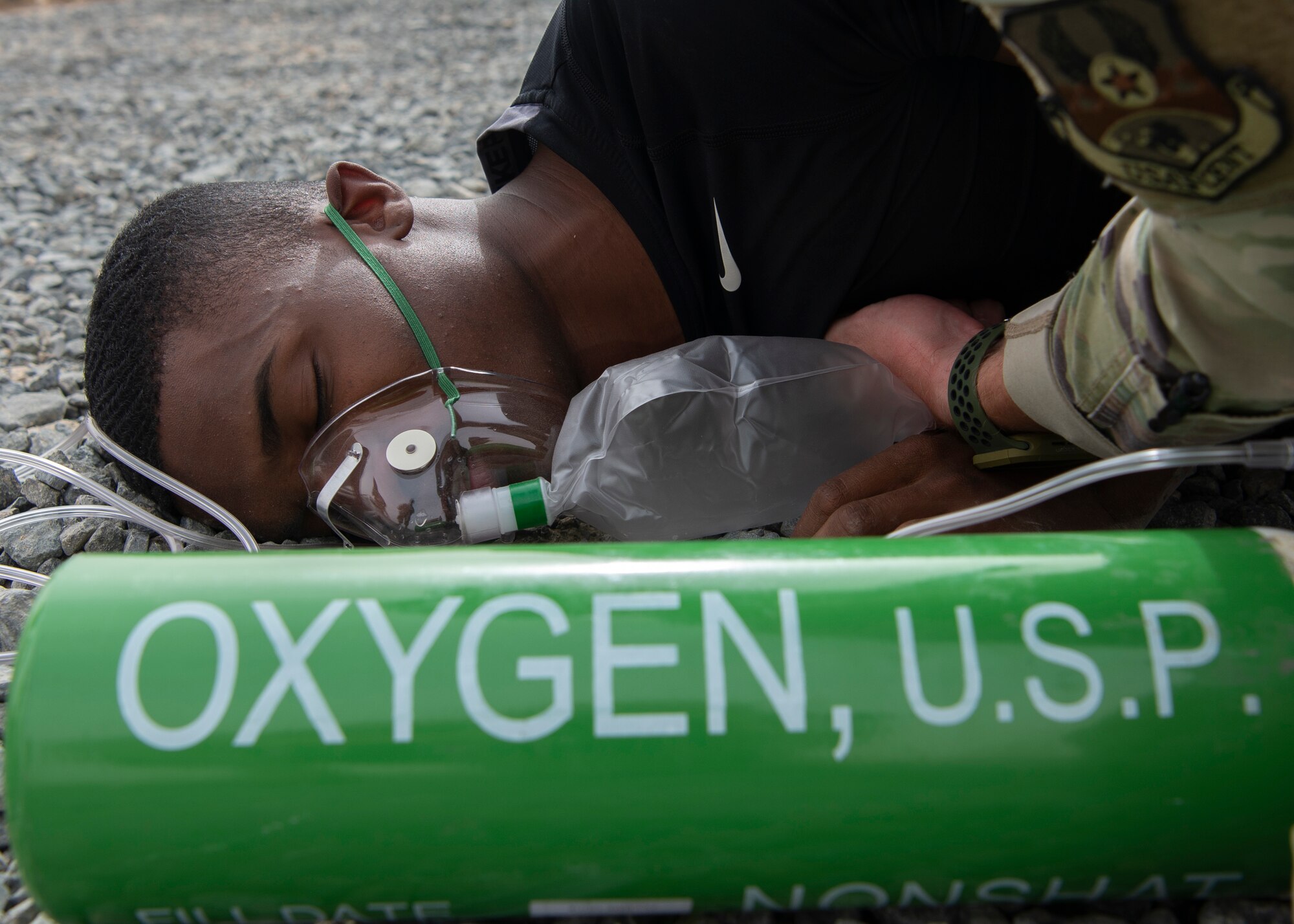 A simulated chemical exposure victim receives triage during an all-hazard training exercise at Ali Al Salem Air Base, Kuwait, May 5, 2020. The all-hazard training exercise allowed 386th Air Expeditionary Wing first responders the opportunity to build cohesion and interoperability between fellow first responding agencies during a simulated real-world scenario. (U.S. Air Force photo by Senior Airman Isaiah J. Soliz)