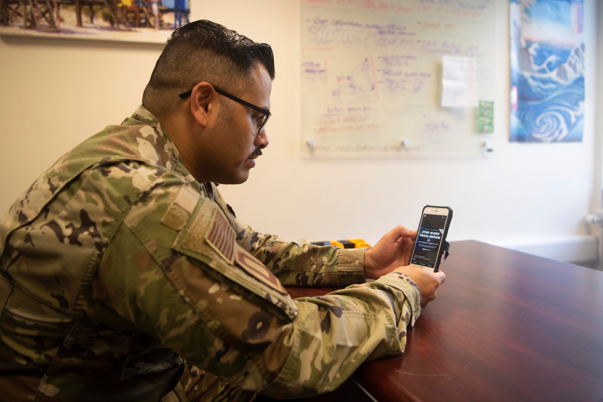 Master Sgt. Carlos Castro, 100th Force Support Squadron Airman and Family Readiness Center readiness noncommissioned officer, monitors the helping agency’s social media page at RAF Mildenhall, England, May 4, 2020. The AFRC has utilized social media to promote services and opportunities to the base community during the COVID-19 lockdown. (U.S. Air Force photo by Airman 1st Class Joseph Barron)