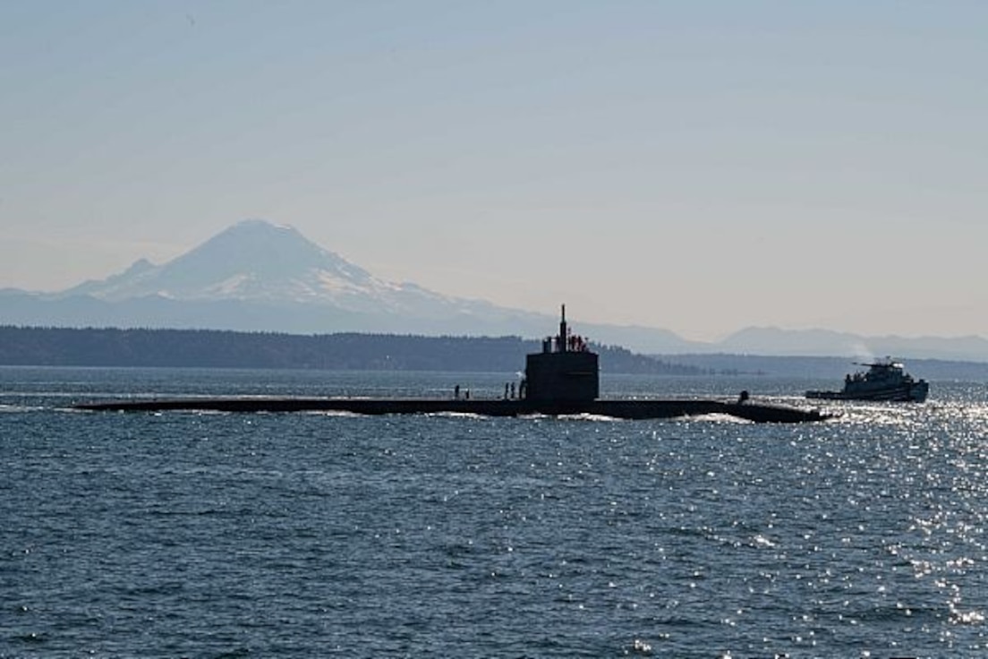 The Los Angeles-class fast-attack submarine USS Olympia (SSN 717) transits the Puget Sound, arriving in to Bremerton, Wash., and is scheduled to begin the inactivation and decommissioning process at Puget Sound Naval Shipyard. The 35-year-old Olympia was commissioned on Nov. 17, 1984. (U.S. Navy photo by Mass Communication Specialist 3rd Class Victoria Foley/Released)