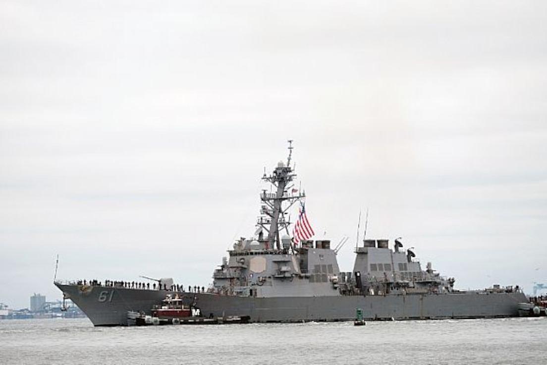 Sailors assigned to the Arleigh Burke-class guided missile destroyer USS Ramage (DDG 61) man the rails as the ship returns from deployment. Ramage returned to Naval Station Norfolk after the successful conclusion of a seven-month deployment. (U.S. Navy photo by Mass Communication Specialist 1st Class Joshua D. Sheppard/Released)