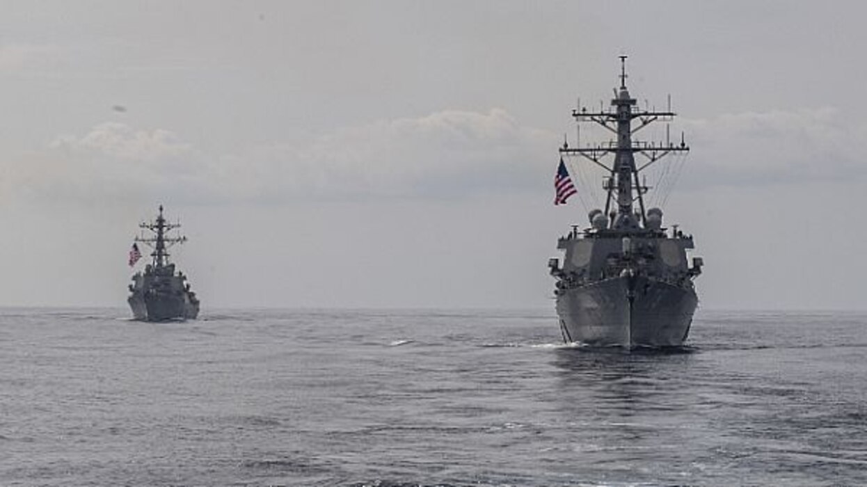 The Arleigh Burke-class guided-missile destroyers USS Porter (DDG 78), right, and USS Donald Cook (DDG 75), are underway in formation for a photo exercise, March 29, 2020. Carney, forward-deployed to Rota, Spain, is on its seventh forward deployed naval force patrol in the U.S. 6th Fleet area of operations in support of regional allies and partners as well as U.S. national security interests in Europe and Africa. (U.S. Navy photo by Mass Communication Specialist 1st Class Fred Gray IV/Released)