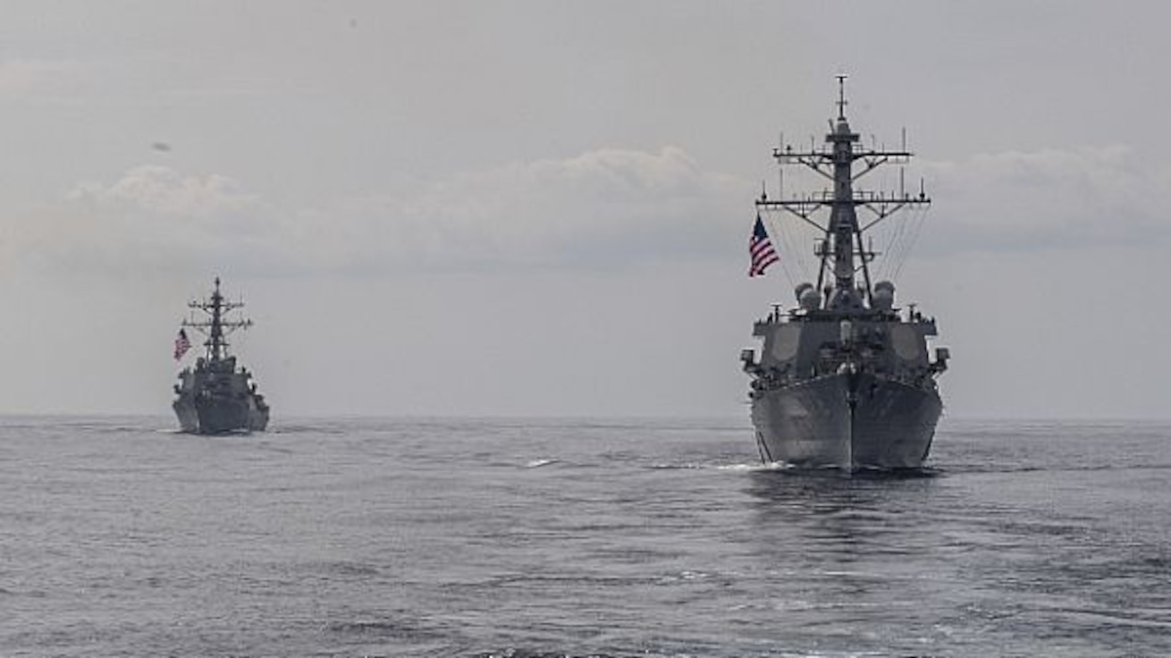 The Arleigh Burke-class guided-missile destroyers USS Porter (DDG 78), right, and USS Donald Cook (DDG 75), are underway in formation for a photo exercise, March 29, 2020. Carney, forward-deployed to Rota, Spain, is on its seventh forward deployed naval force patrol in the U.S. 6th Fleet area of operations in support of regional allies and partners as well as U.S. national security interests in Europe and Africa. (U.S. Navy photo by Mass Communication Specialist 1st Class Fred Gray IV/Released)