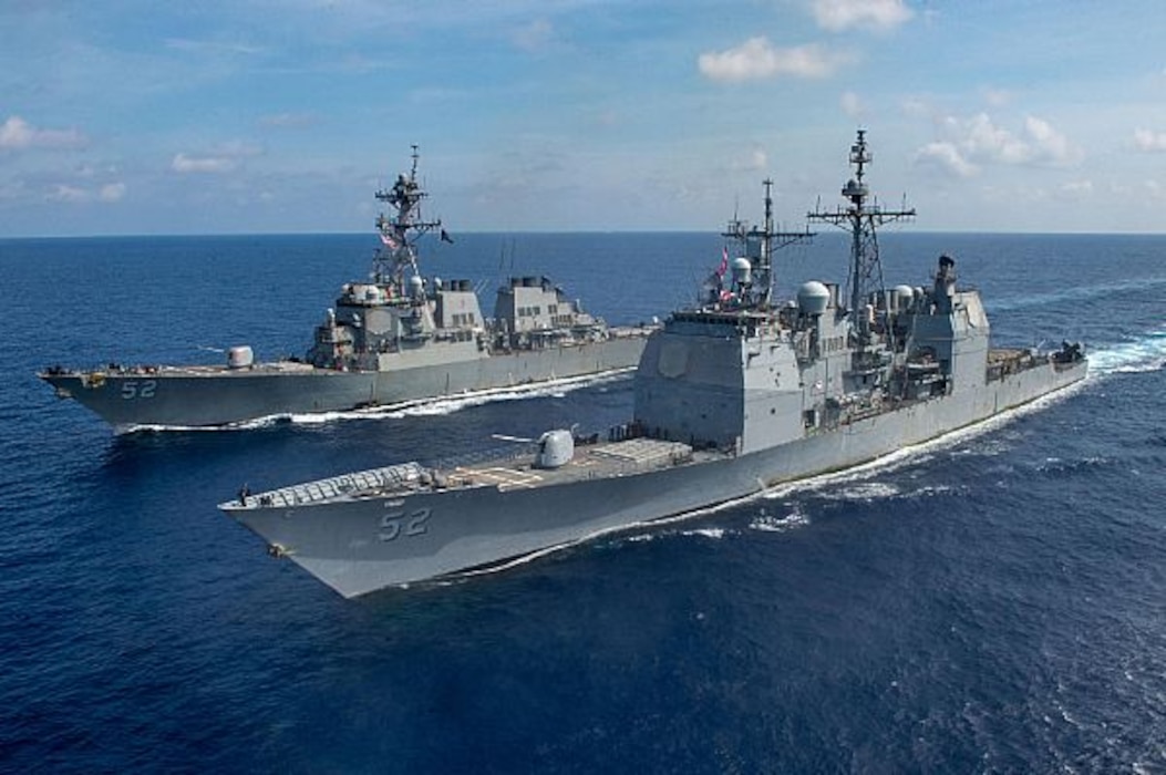 The Ticonderoga-class guided missile cruiser USS Bunker Hill (CG 52), front, and the Arleigh Burke-class guided-missile destroyer USS Barry (DDG 52) transit the South China Sea. Bunker Hill is deployed to the U.S. 7th Fleet area of operations and is operating with the America Expeditionary Strike Group in support of security and stability in the Indo-Pacific region. (U.S. Navy photo by Mass Communication Specialist 3rd Class Nicholas V. Huynh/Released)