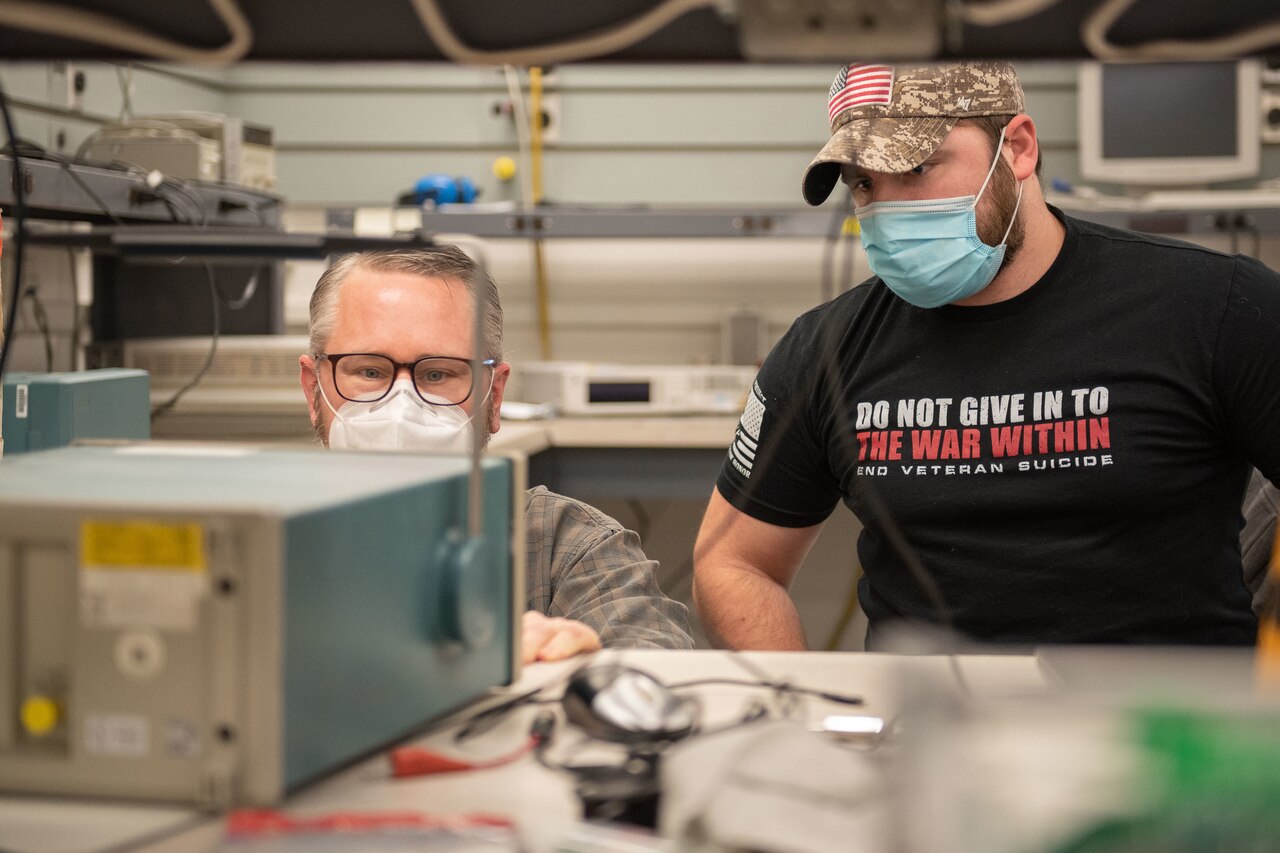 Lab technicians conduct pulse measurements.