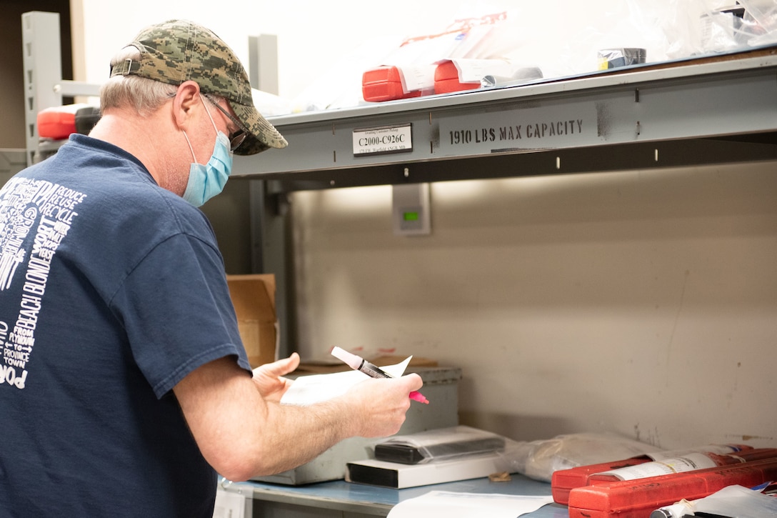 Lab technician prepares inventory for shipment.