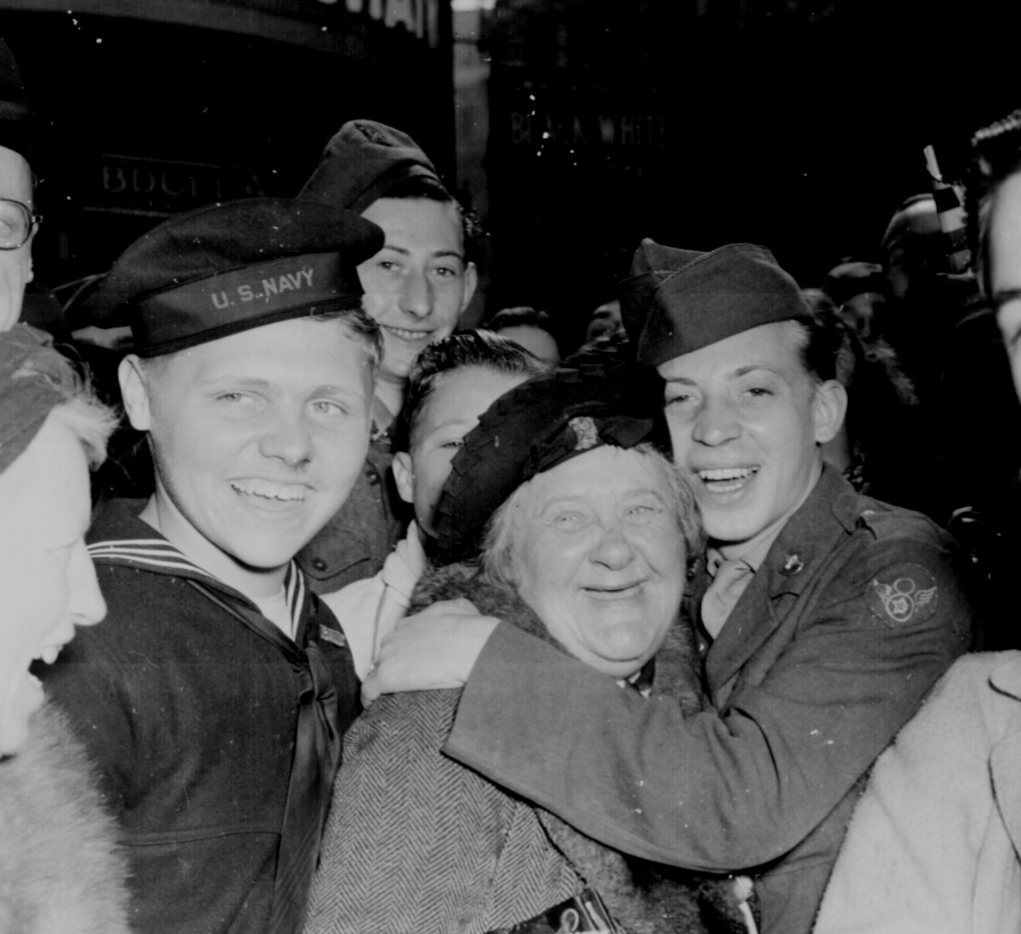 American service members and British citizens celebrate Germany’s unconditional surrender, May 7, 1945 at Piccadilly Circus, London.