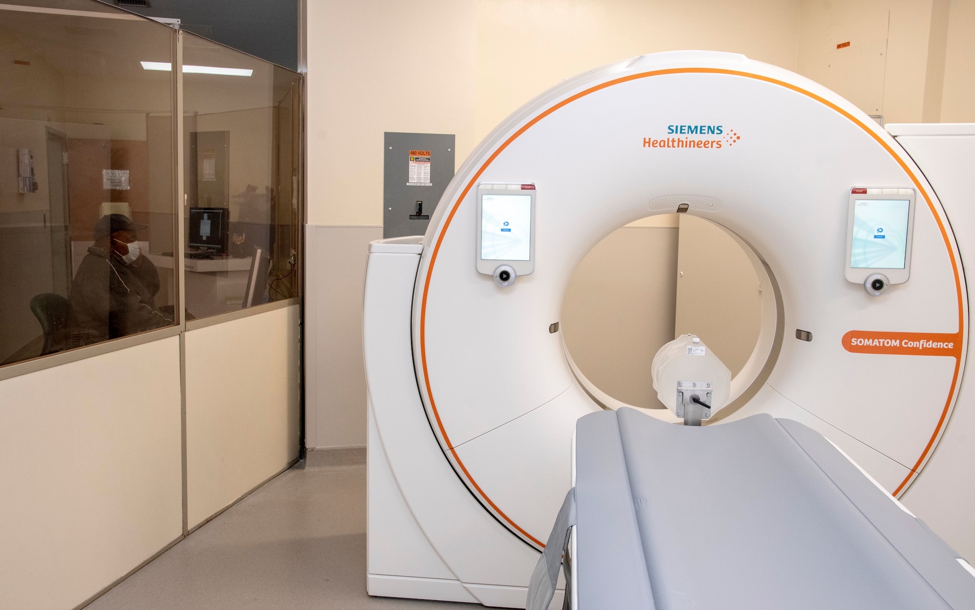 The new CT scanner is started up to ensure it is functioning properly at the Armed Forces Medical Examiner System, Dover Air Force Base, Delaware, April 29, 2020. The new CT scanner, which was installed in the AFMES autopsy suite in April, produce higher-quality images and improved information for medical examiners by increasing to a 80 centimeter field of view and adding dual energy capability which allows the medical examiners to more efficiently accomplish the AFMES mission for post-mortem imaging. (U.S. Air Force photo by Tech. Sgt. Nicole Leidholm)