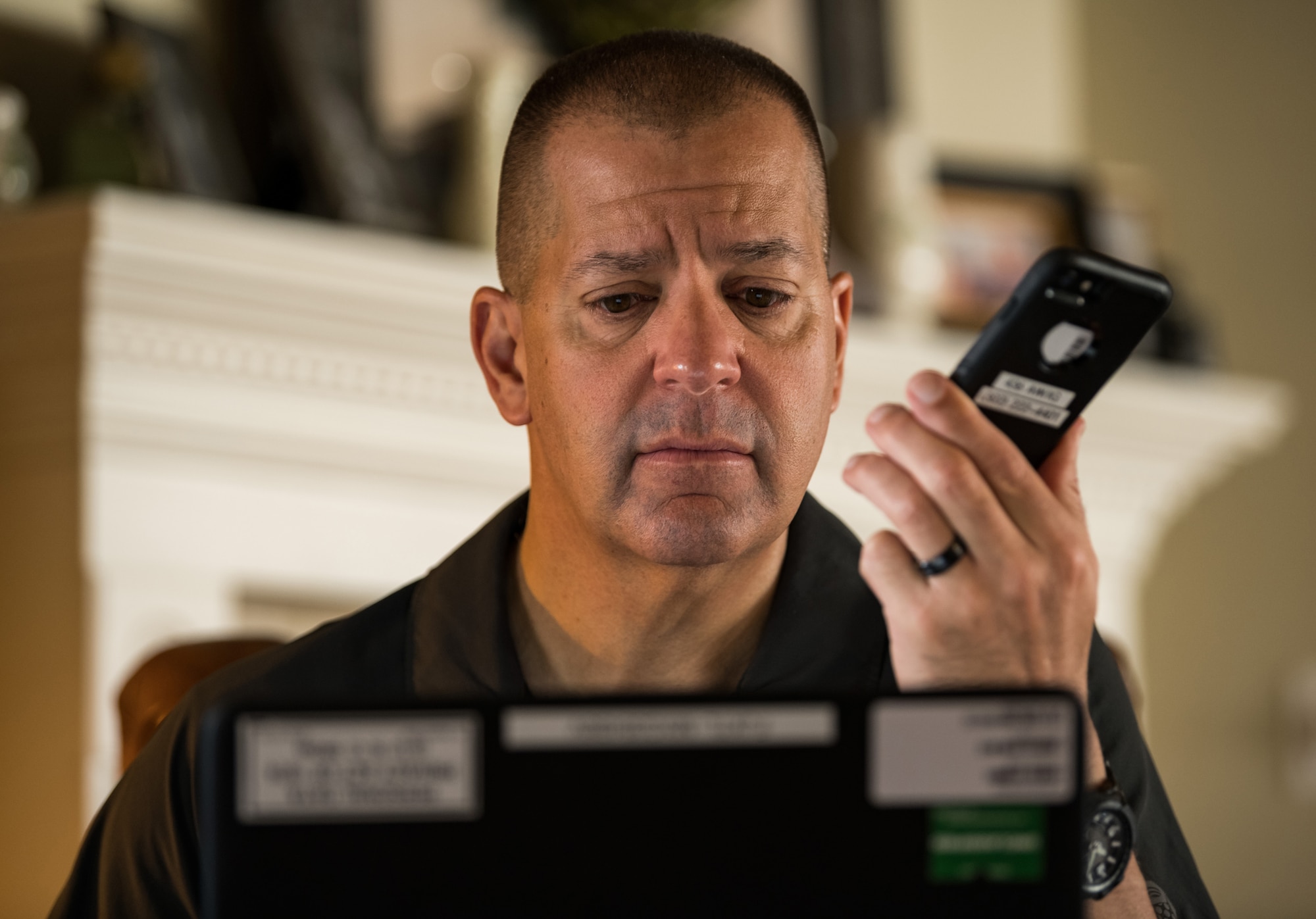 Lt. Col. James Wall, 436th Airlift Wing inspector general and current battle staff director, teleworks from his house using government equipment April 28, 2020, on Dover Air Force Base, Delaware. Wall, the battle staff and Team Dover members resorted to teleworking, if possible, after shelter-in-place orders were put into place in mid-March to help mitigate the spread of COVID-19. (U.S. Air Force photo by Roland Balik)