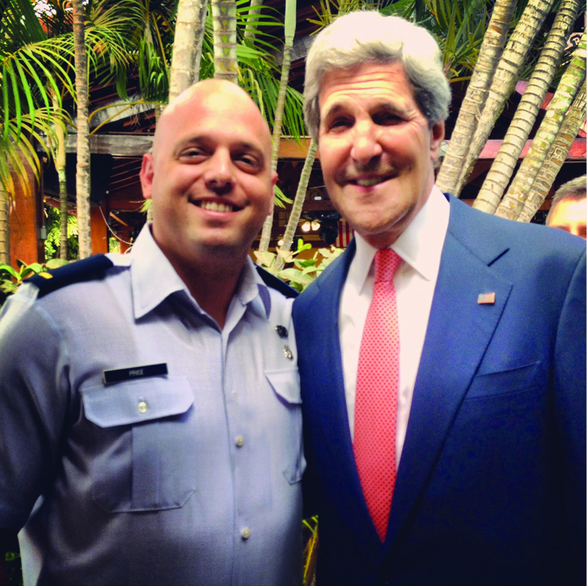 Capt Christopher Price with Former Secretary of State John Kerry at the U.S. Embassy in Brasilia, Brasil. Photo compliments of Capt Christopher Price.