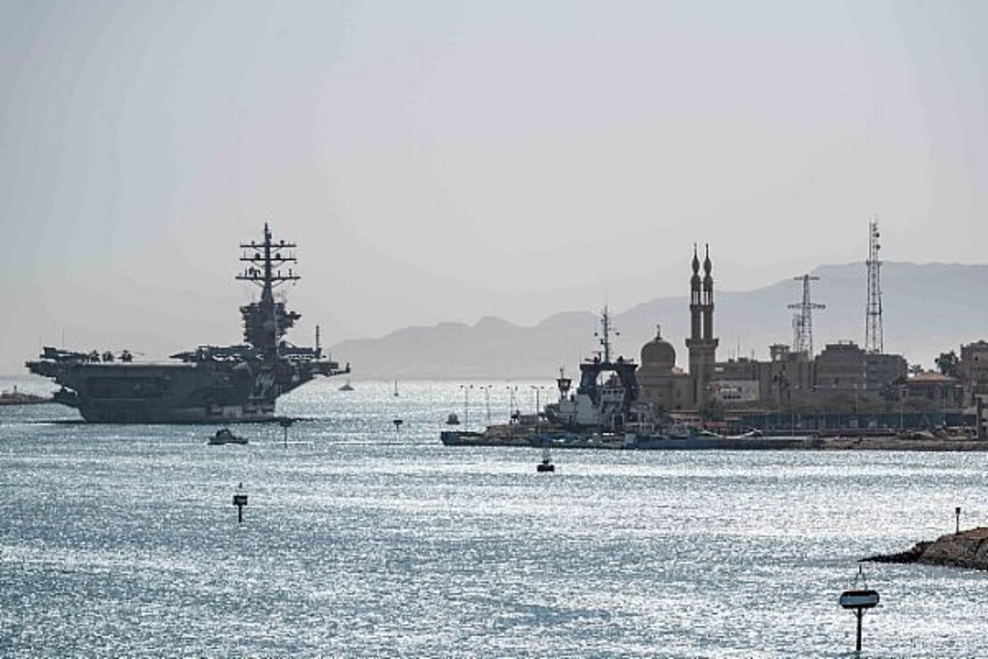 The aircraft carrier USS Dwight D. Eisenhower (CVN 69) transits the Suez Canal, March 9, 2020. Dwight D. Eisenhower is deployed to the U.S. 5th Fleet area of operations in support of naval operations to ensure maritime stability and security in the Central Region, connecting the Mediterranean and Pacific through the western Indian Ocean and three strategic choke points. (U.S. Navy photo by Mass Communication Specialist 3rd Class Kody A. Phillips/Released)