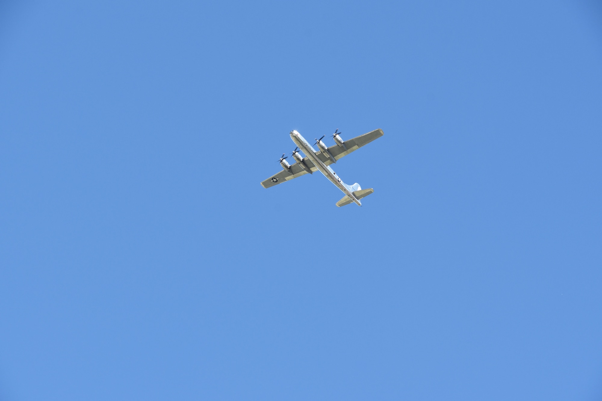 A B-29 Superfortress known as ‘Doc,' flys over Derby Rock Regional Hospital as part of a Total Force formation flyover May 6, 2020, at Derby, Kansas.  The four-ship flyover included 'Doc' and one KC-46A Pegasus and two KC-135 Stratotankers, consisting of 931st and 22nd Air Refueling Wing aircrews.  The planes flew over 11 other local area hospitals to show appreciation for essential personnel on the front lines of COVID-19.  (U.S. Air Force photo by Tech. Sgt. Abigail Klein)