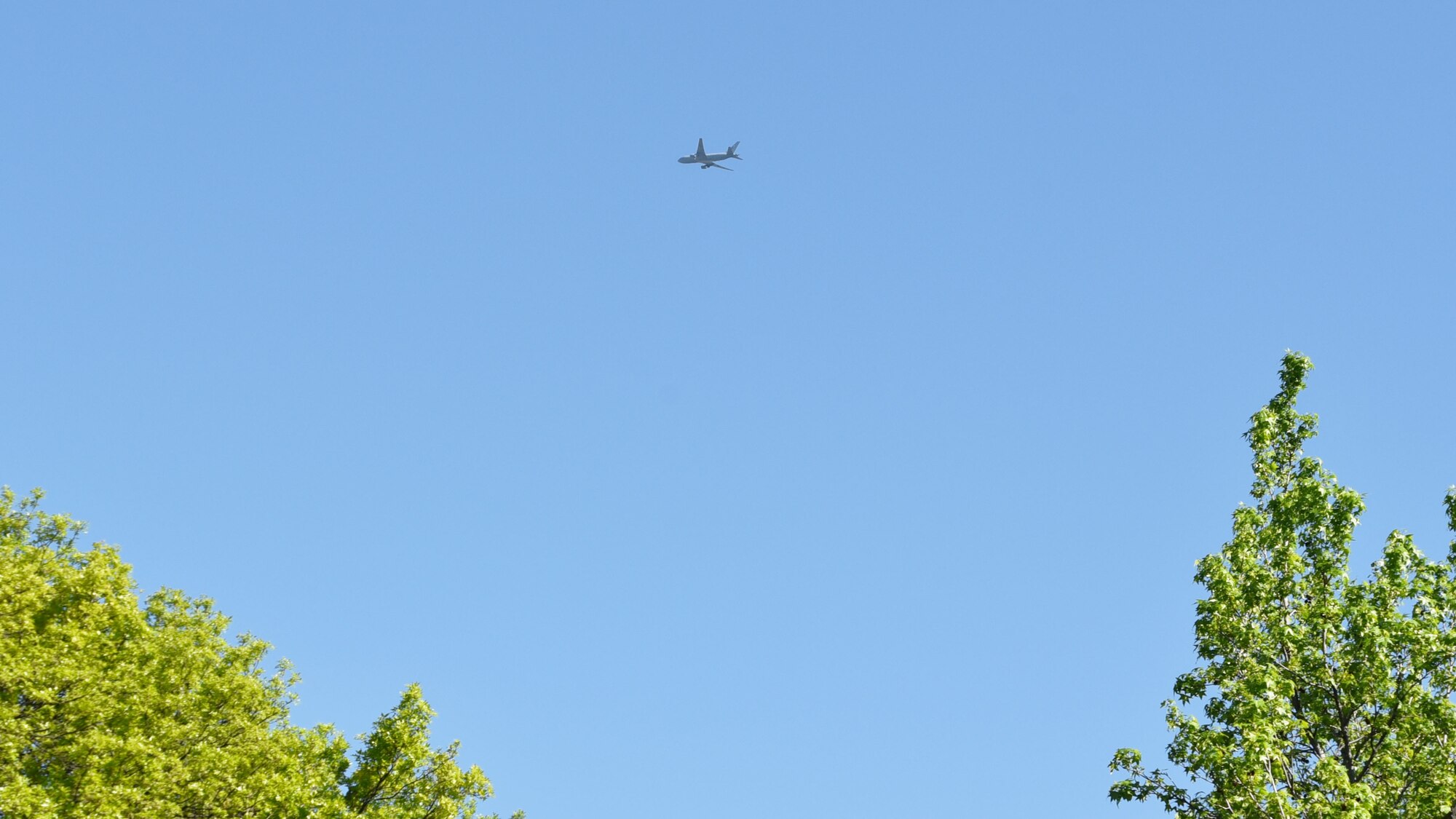 A KC-46A Pegasus assigned to the 22nd Air Refueling Wing flys near Wesley Hospital as part of a Total Force formation flyover May 6, 2020, at Wichita, Kansas.  Both 931st and 22nd Air Refueling Wing aircrews flew over 11 local hospitals to salute all healthcare workers, first responders and other essential personnel on the front lines of COVID-19.  (U.S. Air Force photo by Tech. Sgt. Abigail Klein)