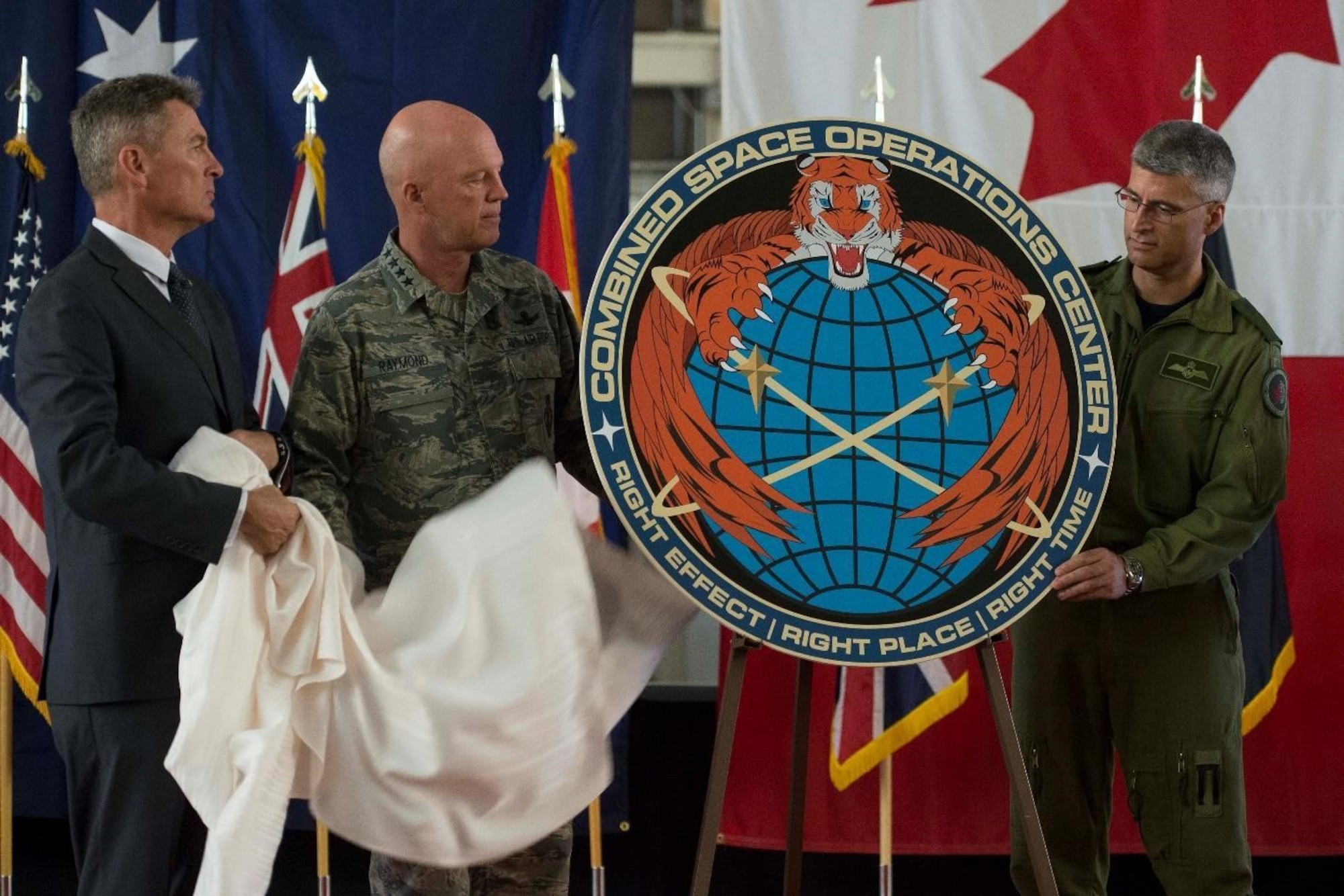 In a file photo from July 18, 2018, representatives from Australia, Canada, and the United Kingdom joined Gen. Jay Raymond, current U.S. Space Force Chief of Space Operations, in marking the transition of the Joint Space Operations Center (JSpOC) to the CSpOC.