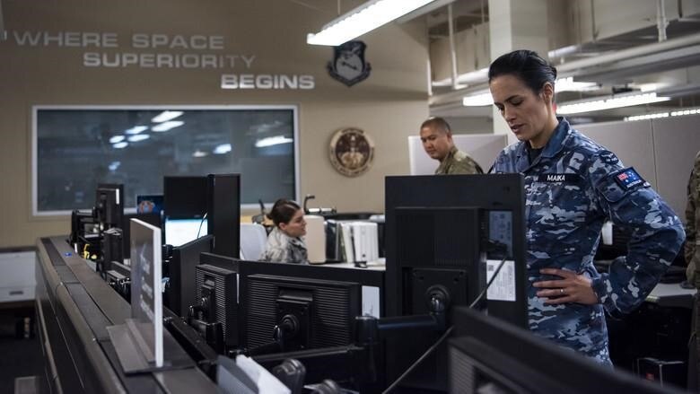 Royal Australian Air Force Squadron Leader Jamiee Maika is seen in the Combined Space Operations Center (CSpOC) at Vandenberg Air Force Base, California. Additional nations collaborating on space operations with the CSpOC include Germany, France and New Zealand.