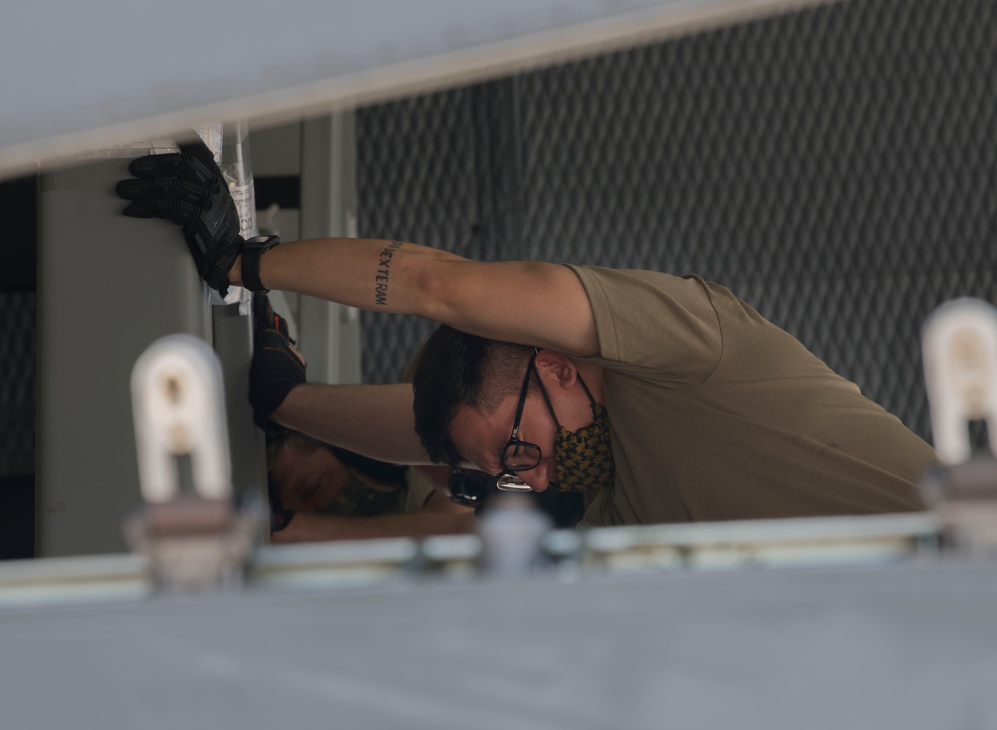 An Airman from the 22nd Airlift Squadron helps push a stuck cargo pallet onto a C-5M Super Galaxy from Travis Air Force Base, California, April 27, 2020 on Peterson AFB, Colorado. While being loaded the pallet came into the C-5 crooked, requiring Airmen from the 22nd ALS, 21st Logistics Readiness Squadron and passengers from the Space and Missile Systems Center to work together to make sure it was loaded and secured properly. The 21st LRS and the 22nd ALS helped transport cargo to assist in a SMC Rapid Reaction Branch mission to support operations down range for five combatant commands. (U.S. Air Force photo by Airman 1st Class Andrew J. Bertain)