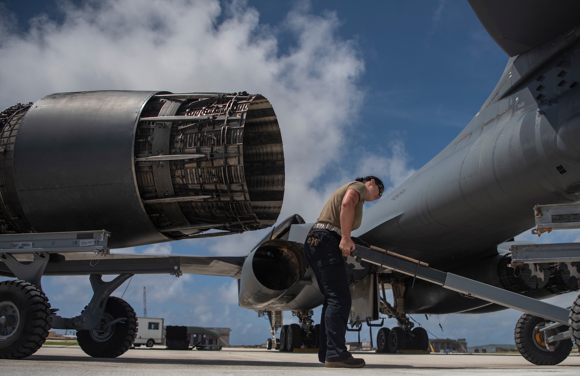 Senior Airman Shelby Ries, 7th Aircraft Maintenance Squadron aerospace propulsion mechanic, loads an engine onto a trailer at Andersen Air Force Base, Guam, May 3, 2020. The B-1 has four engines that can produce 30,000 lbs. of thrust each. Four B-1Bs deployed to Andersen as part of U.S. Strategic Command’s support to the National Defense Strategy objectives of strategic predictability and operational unpredictability by using a mix of different aircraft to and from various dispersed U.S. bases and other departure and arrival points, to include Guam. (U.S. Air Force photo by Senior Airman River Bruce)