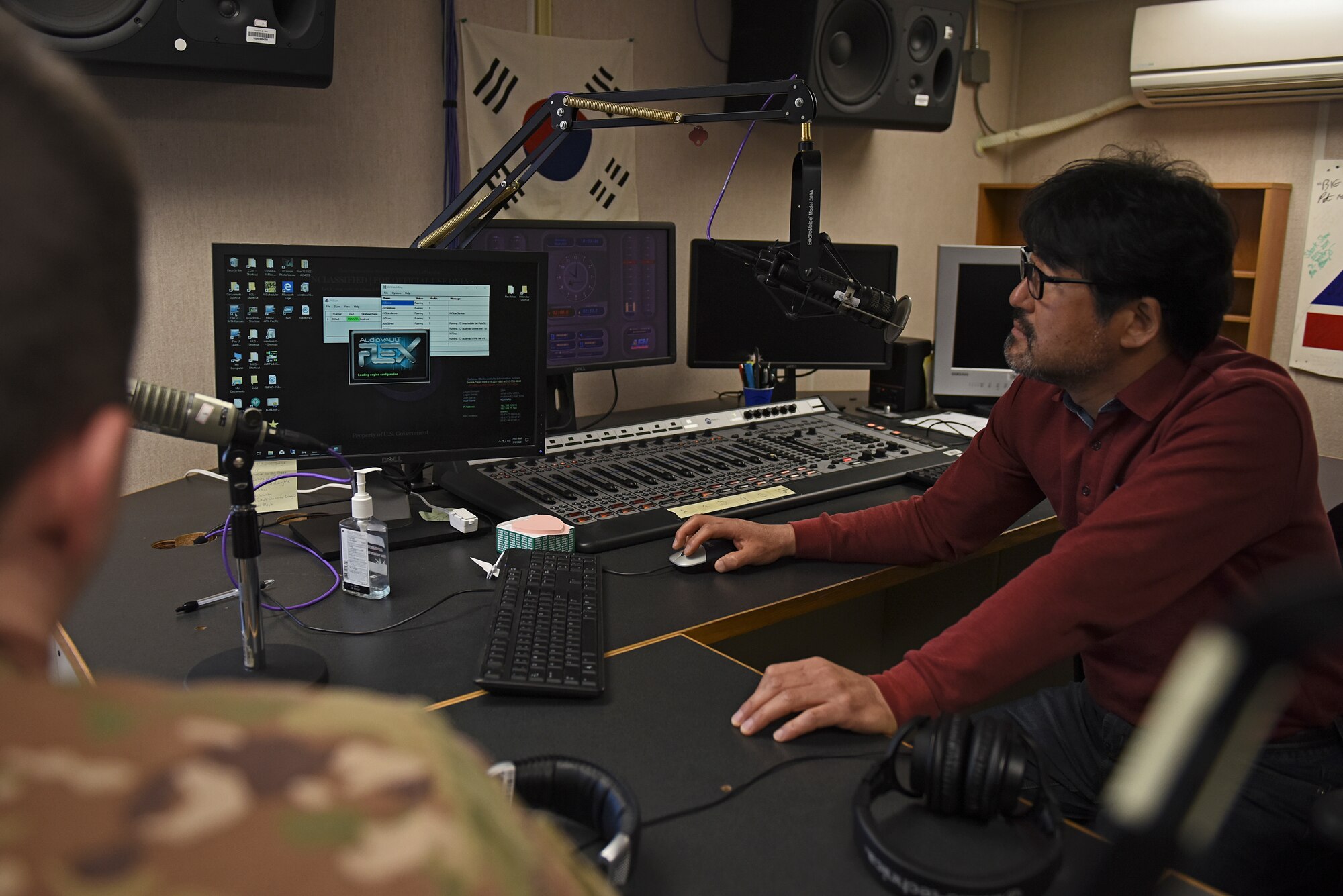 Yun Chol Chu, American Forces Network electrical technician, and U.S. Air Force Staff Sgt. Cameron Cook, AFN broadcast maintenance manager, troubleshoot an issue in AFN Kunsan’s studio at Kunsan Air Base, Republic of Korea, May 6, 2020. AFN Kunsan maintains a technical services section to ensure the equipment used to produce and broadcast functions properly. (U.S. Air Force photo by Staff Sgt. Mackenzie Mendez)