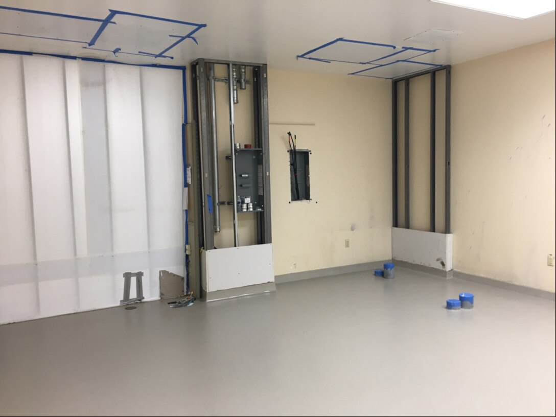 New flooring and electrical conduit is installed at the Armed Forces Medical Examiner System, Dover Air Force Base, Delaware, April 20, 2020 prior to the arrival of AFMES new CT scanner. The 2-month project of replacing the CT scanner meant the removal of the old scanner, new flooring and electrical conduit to prepare for the new scanner and installation the new scanner itself. (Courtesy photo)