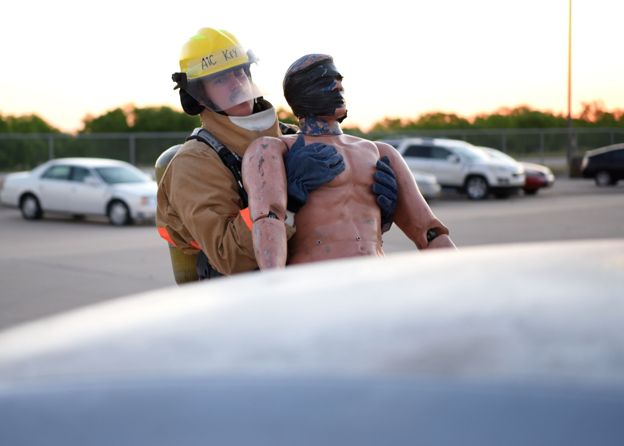 U.S. Air Force Airman 1st Class Coleman Key, 312th Training Squadron student, pulls a victim from a simulated car accident during his final exercise for Block III at the Louis F. Garland Department of Defense Fire Academy on Goodfellow Air Force Base, Texas, May 6, 2020. Key pulled from all the lessons he was taught to complete the exercise. (U.S. Air Force photo by Airman 1st Class Ethan Sherwood)
