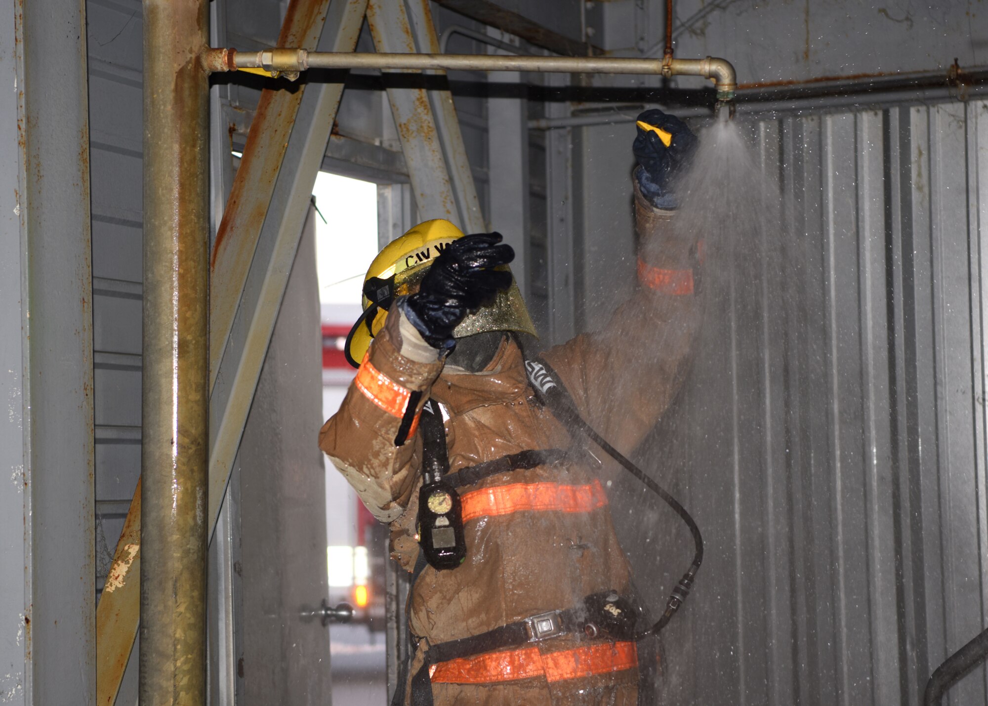A 312th Training Squadron student responds to a call about a leak during the final exercise of Block III at the Louis F. Garland Department of Defense Fire Academy on Goodfellow Air Force Base, Texas, May 6, 2020. Firefighters were trained for much more than just responding to fires, they also handle leaks, structural damage, rescue, and other crises. (U.S. Air Force photo by Airman 1st Class Ethan Sherwood)