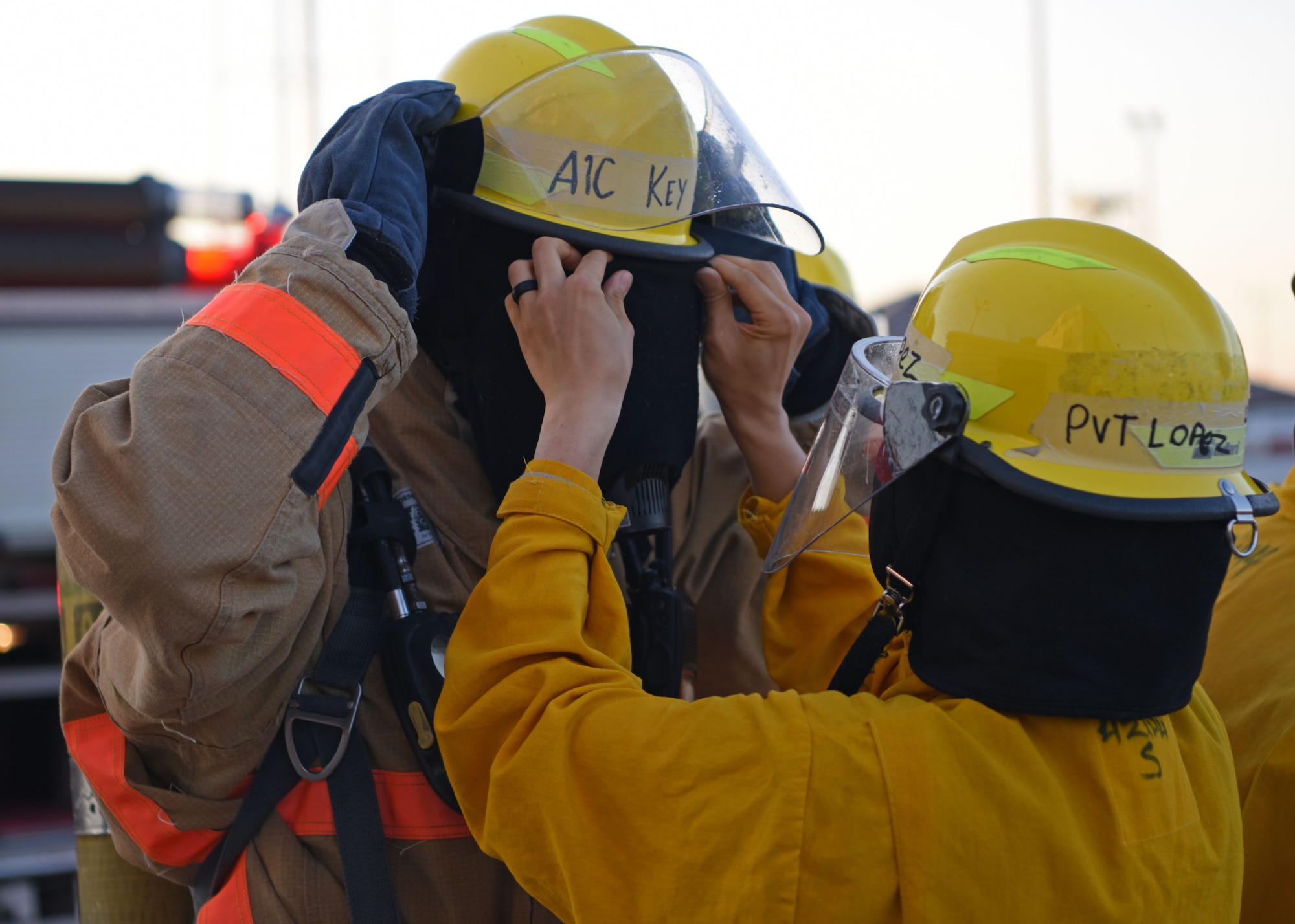 U.S. Air Force Airman 1st Class Coleman Key is fitted with a blindfold to simulate the challenge of seeing through smoke at the Louis F. Garland Department of Defense Fire Academy on Goodfellow Air Force Base, Texas, May 6, 2020. Social distancing for firefighters was difficult, but was overcome by teamwork and communication. (U.S. Air Force photo by Airman 1st Class Ethan Sherwood)