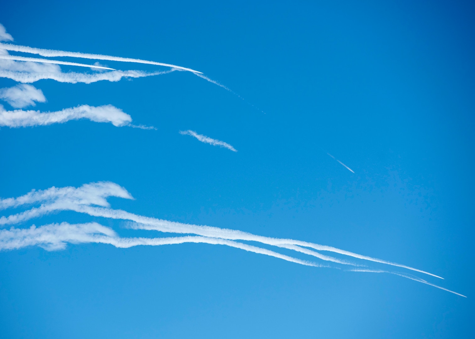 U.S. Air Force F-22 Raptors fly over Joint Base Elmendorf-Richardson, Alaska, following a close formation taxi known as an elephant walk, May 5, 2020. This event displayed the ability of the 3rd Wing, 176th Wing and the 477th Fighter Group to maintain constant readiness throughout COVID-19 by Total Force Integration between active-duty, Guard and Reserve units to continue defending the U.S. homeland and ensuring a free and open Indo-Pacific.